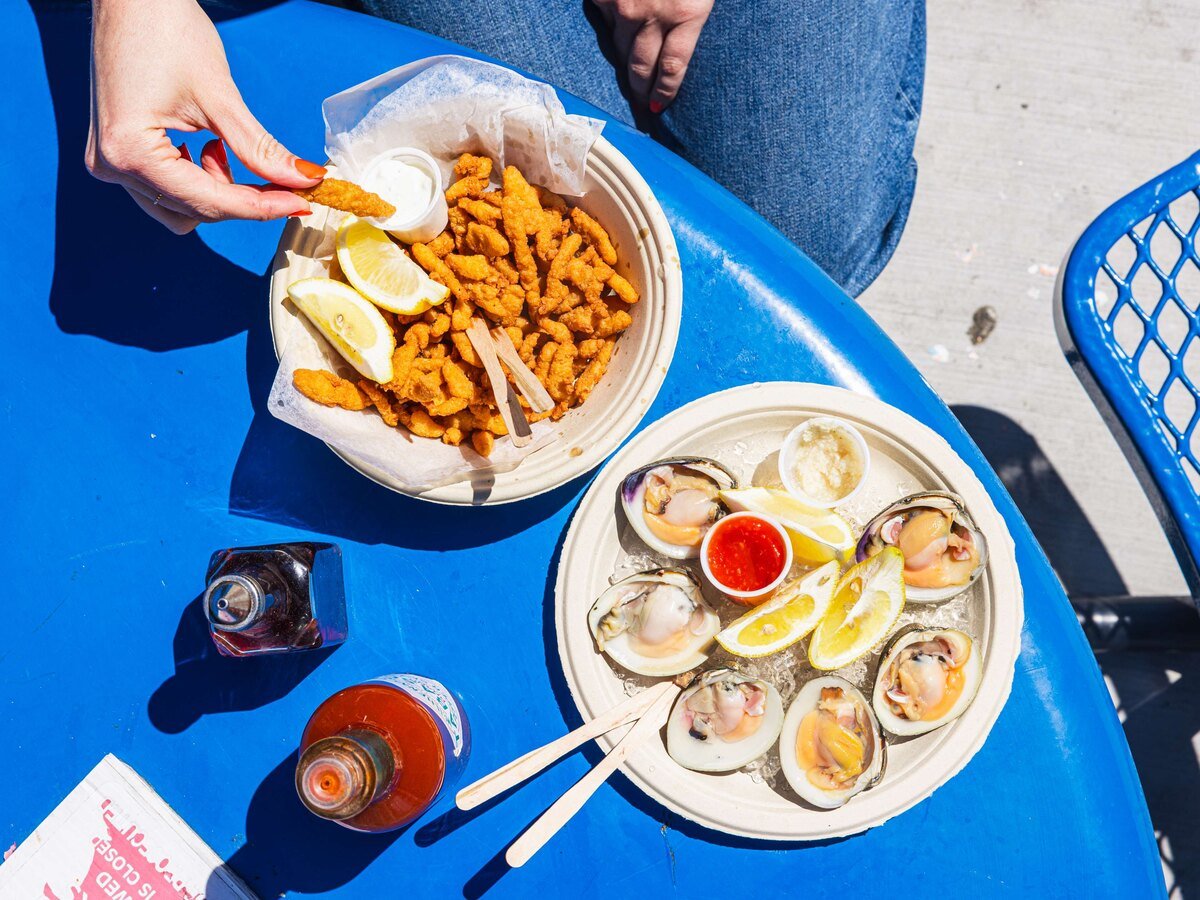 Fried clam strips and raw clams on the half shell at Pete's Clam Stop, Coney Island